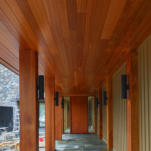 Pivot door and massive Sapele Mahogany columns and half columns in Bar Harbor, Maine made by by Spiritcraft Furniture