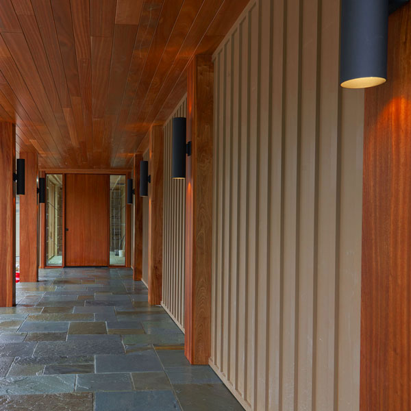 Pivot door and custom Sapele Mahogany columns and half columns in Bar Harbor, Maine made by by Spiritcraft Furniture